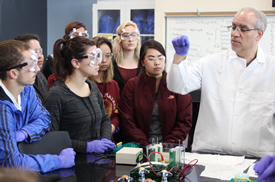 Image of students and instructor working in classroom setting