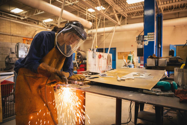 A person in safety gear practicing welding