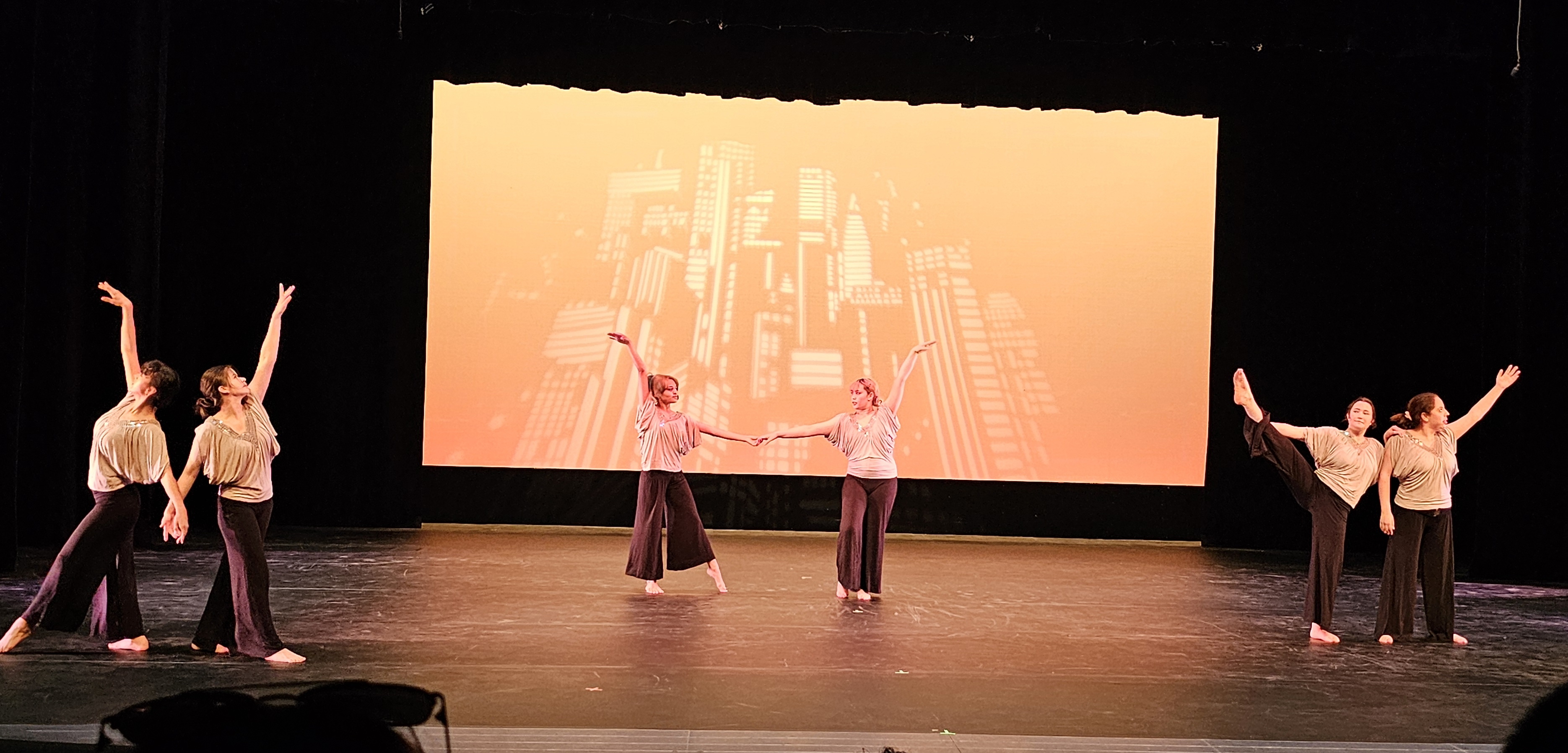 Dance program students on stage performing
